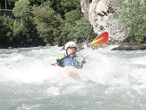 A person in a white water rafting Description automatically generated