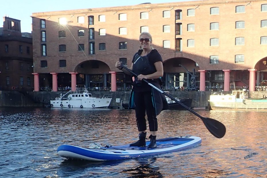 A person on a paddle board Description automatically generated