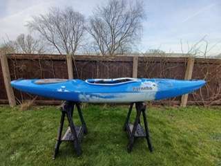 A blue kayak on a stand

Description automatically generated