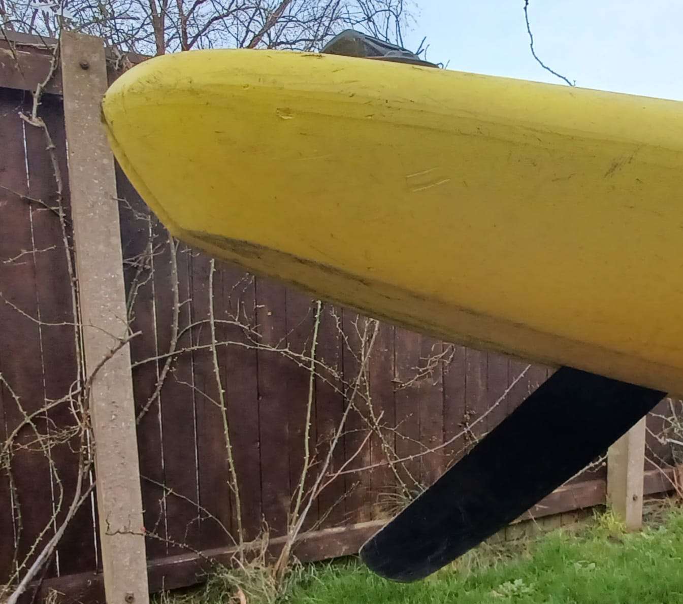 A yellow boat with black propeller

Description automatically generated
